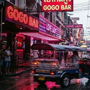 Neon go-go bar street in Bangkok nightlife district at night
