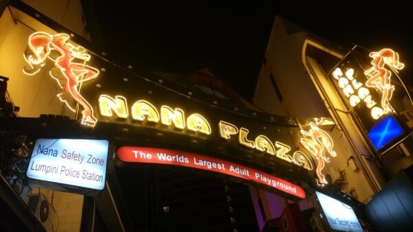 The Nana Plaza entrance on Sukhumvit Soi 4 lit up at night, the centre of the guest-friendly hotel cluster