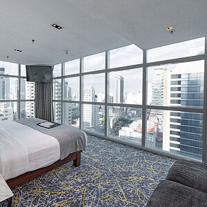 Panorama View Suite at S31 Sukhumvit Hotel Bangkok, with wrap-around floor-to-ceiling windows over the city