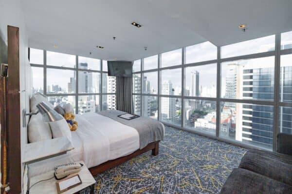 Panorama View Suite at S31 Sukhumvit Hotel Bangkok, with wrap-around floor-to-ceiling windows over the city