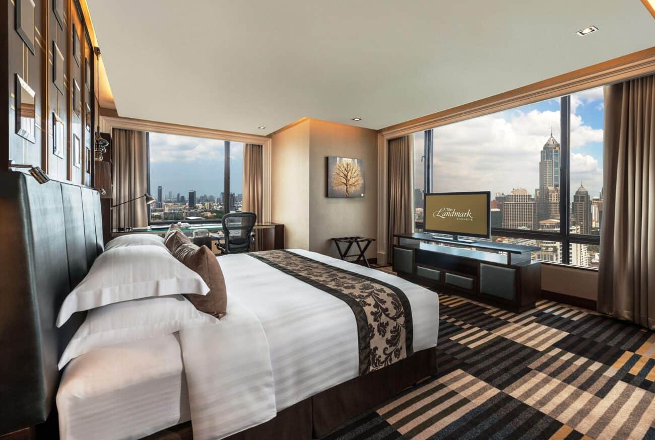 A corner room at The Landmark Bangkok with floor-to-ceiling windows on two sides over Sukhumvit