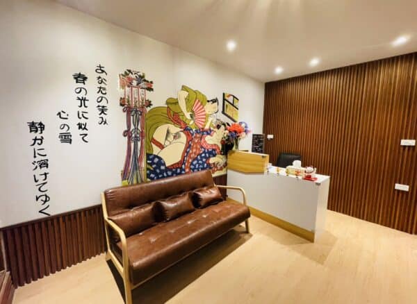 Reception at Sukebe Nuru Massage, Sukhumvit Soi 18, with shunga wall mural and Japanese calligraphy
