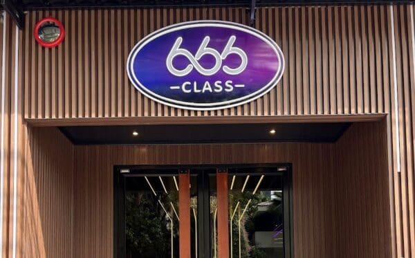 Entrance to 666 Class Nuru Massage on Sukhumvit Soi 33, with its oval 666 Class sign