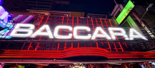 The illuminated Baccara sign on Soi Cowboy, Bangkok