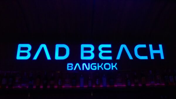 Illuminated Bad Beach Bangkok sign above the back bar at Bad Beach, Soi Cowboy