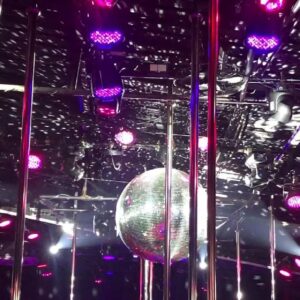 Stage poles, disco ball and lighting rig inside Billboard on the top floor of Nana Plaza, Bangkok