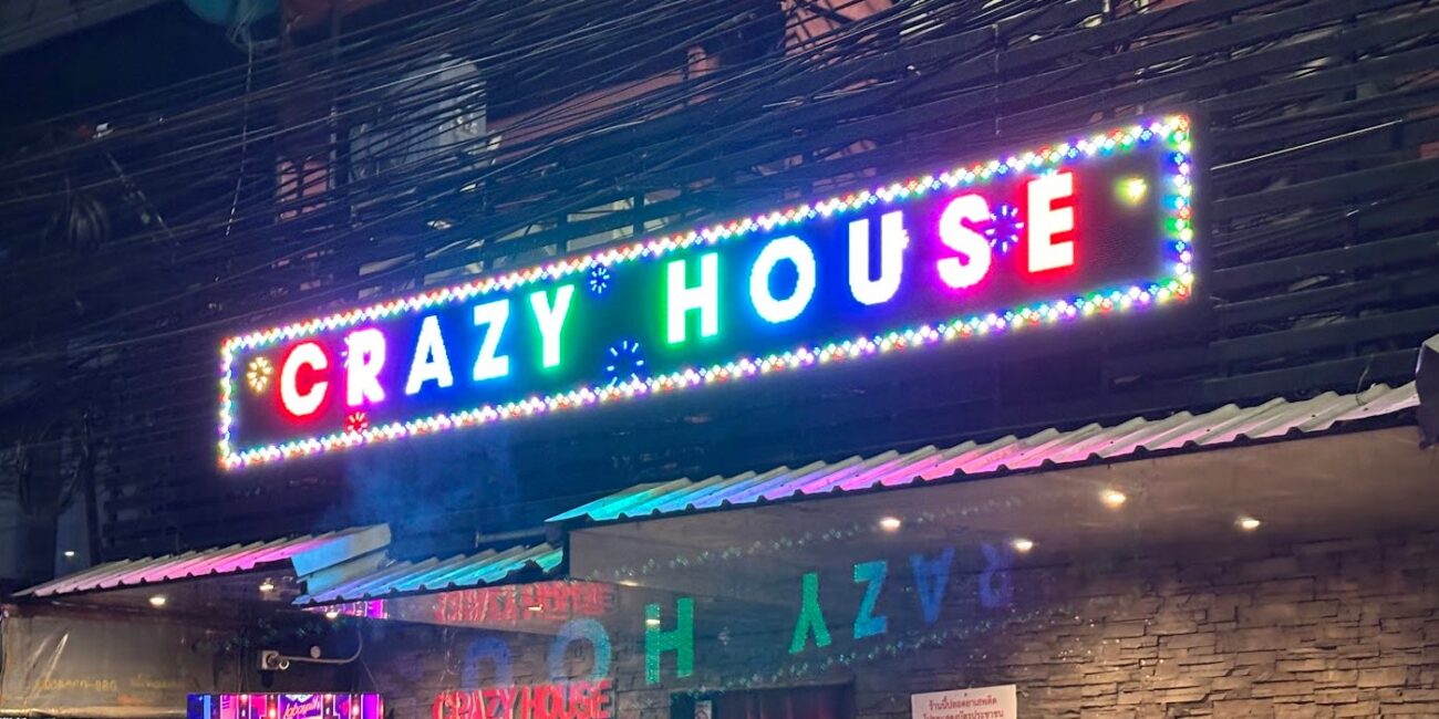 Illuminated Crazy House sign at the Soi 23 end of Soi Cowboy, Bangkok