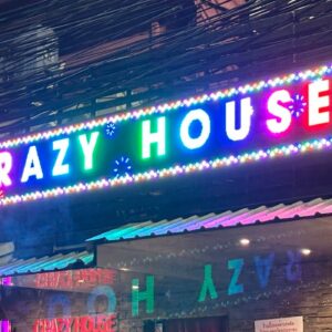 Illuminated Crazy House sign at the Soi 23 end of Soi Cowboy, Bangkok