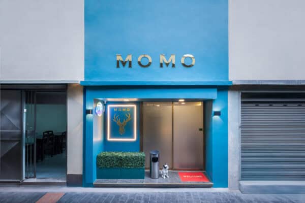 Blue storefront of Momo Massage on Soi 53/1 by BTS Thong Lo, with gold MOMO lettering