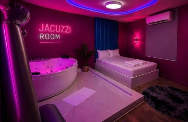 Jacuzzi room with neon lettering at Pattaya Vice Nuru Massage, Pattaya