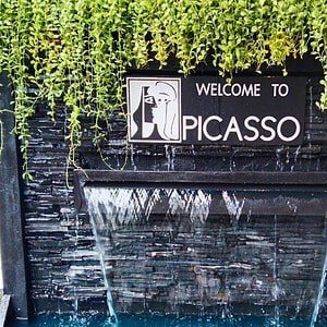 Welcome to Picasso sign over a water wall at Picasso Massage, Sukhumvit Soi 19