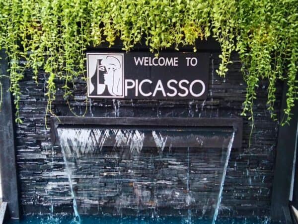 Welcome to Picasso sign over a water wall at Picasso Massage, Sukhumvit Soi 19