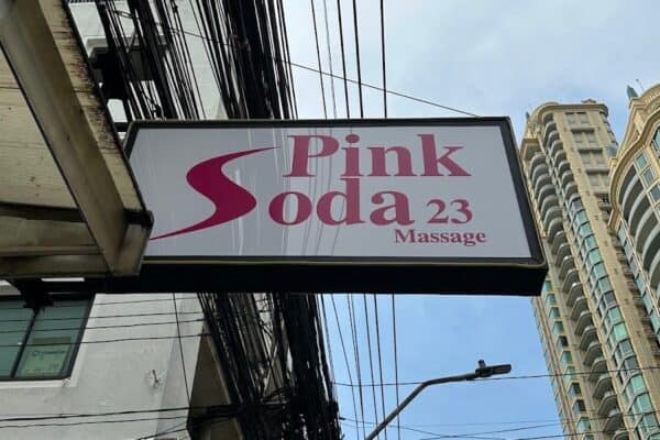 Pink Soda 23 Massage lightbox hanging over Sukhumvit Soi 23, Bangkok