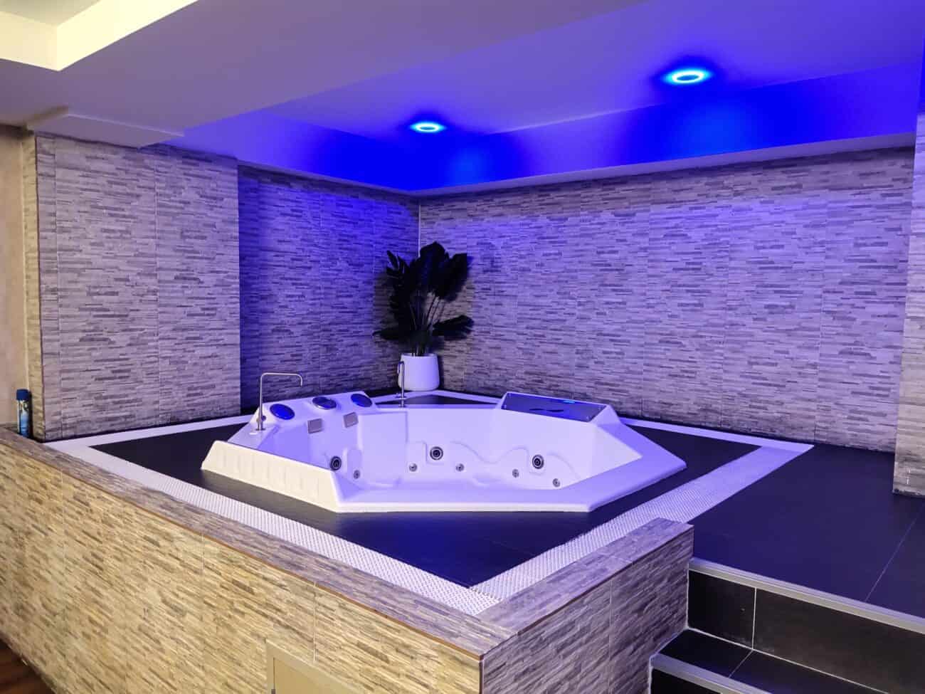 Sunken jacuzzi under blue lights in a suite at The Bank, Soon Wichai 14 off Rama 9 Road