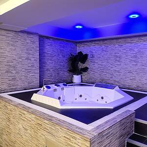 Sunken jacuzzi under blue lights in a suite at The Bank, Soon Wichai 14 off Rama 9 Road