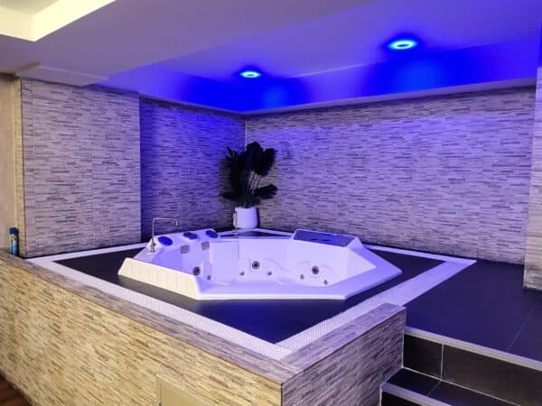 Sunken jacuzzi under blue lights in a suite at The Bank, Soon Wichai 14 off Rama 9 Road