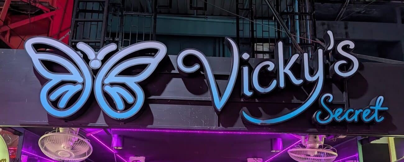 Vicky's Secret butterfly neon sign over the bar on Soi Cowboy